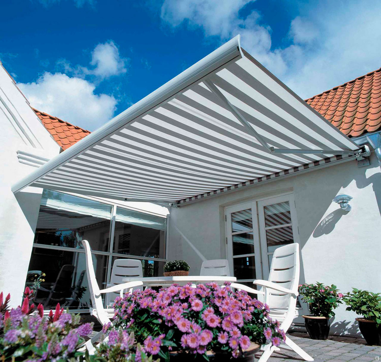 Folding arm awnings